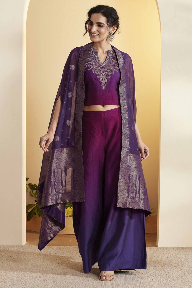 Woman wearing a purple BIBA festive ensemble